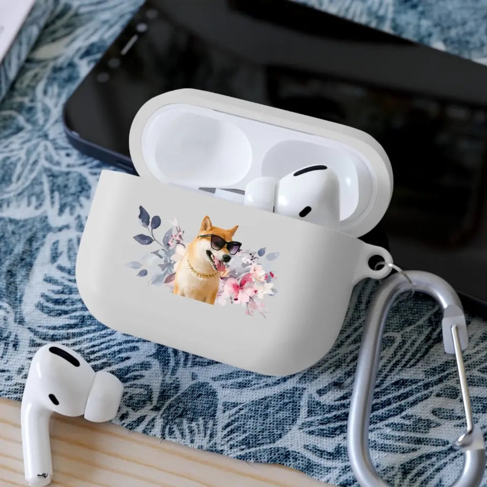 Custom AirPods Pro case with pet photo of dog, floral design, and carabiner clip on a table with earbuds nearby.