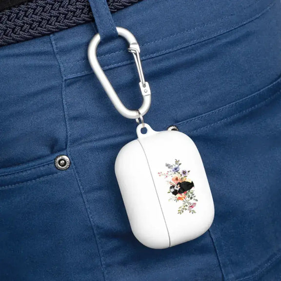 Custom AirPods case with floral pet design clipped to blue jeans for personalized pet-inspired style.