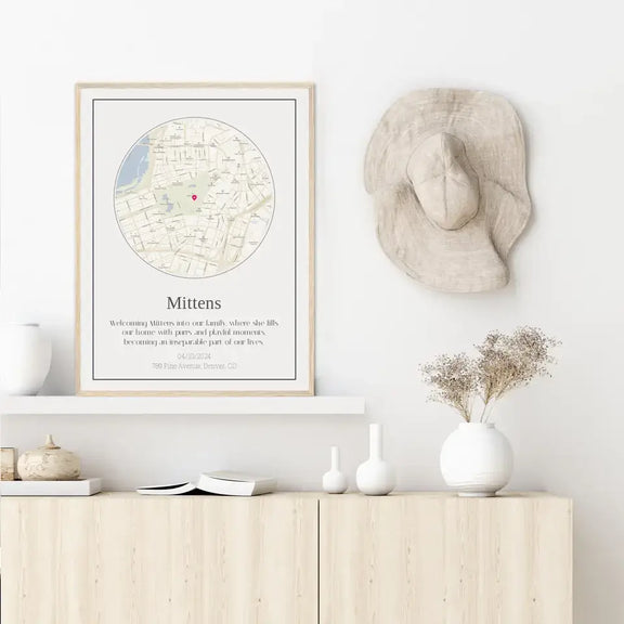 Custom journey map print for cat parents displayed on modern wooden shelf with decorative objects.