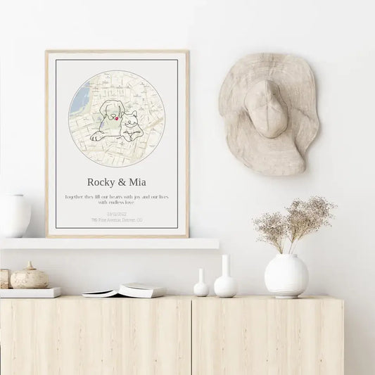 Personalized pet map gift featuring custom illustration of dogs on a stylish home wall.