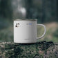 Custom 12oz enamel camping mug with personalized pet photo, placed on a forest log, perfect for outdoor adventures.