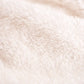 Close-up of soft Sherpa fleece texture on a white personalized Halloween throw blanket.