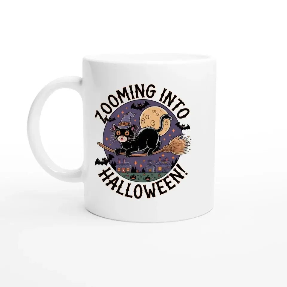 Personalized Halloween ceramic mug with a black cat on a broomstick, flying over a haunted town and full moon, captioned "Zooming into Halloween!"