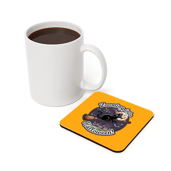 Personalized Halloween pet coaster with black cat design, perfect for spooky holiday decorations, next to a coffee mug.