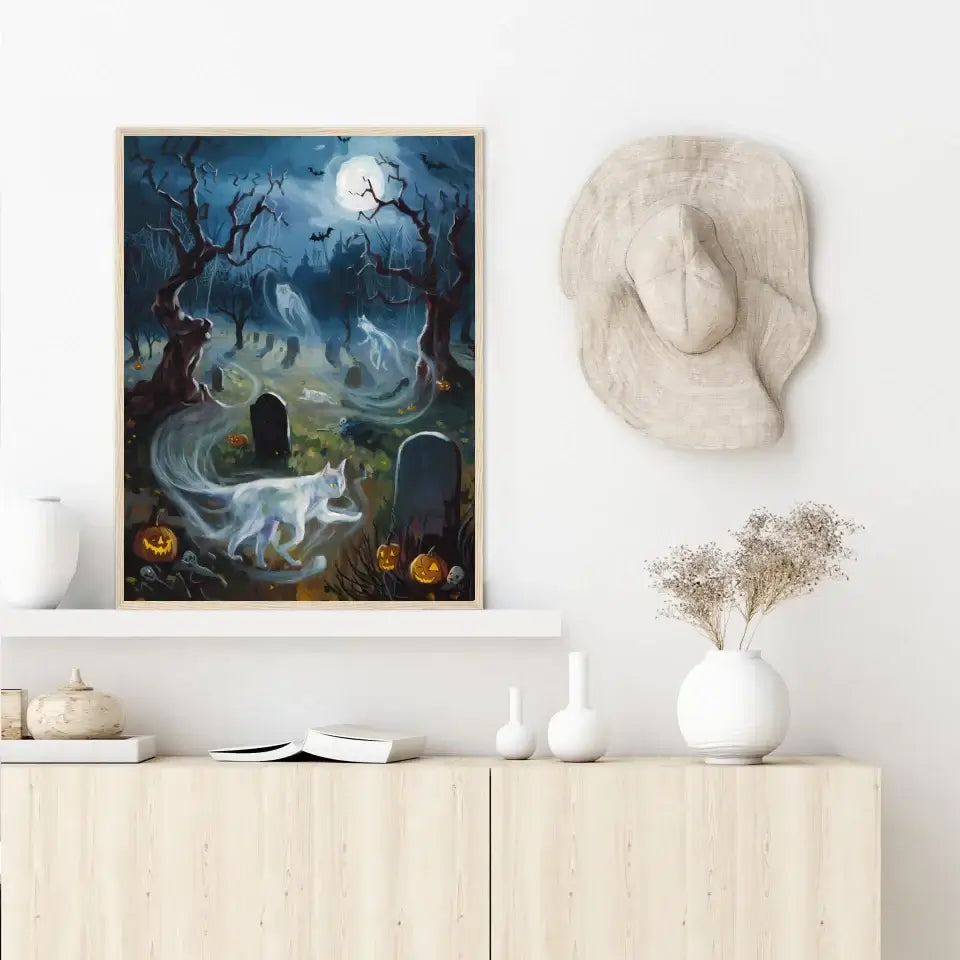 Framed poster of ghostly cats weaving through a Halloween night with tombstones and full moon, titled "Feline Whispers."