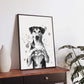 Framed dog art print with a dog forming a heart shape with its paws on a modern wooden table.