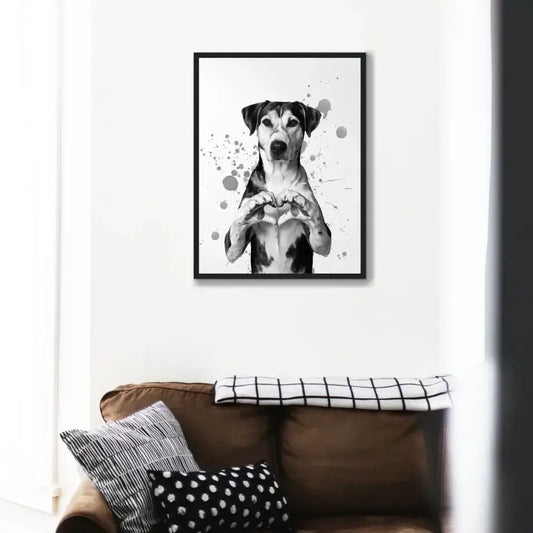 Framed print of a dog forming a heart with its paws, showcasing Canine Love art above a sofa.