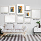 Gallery wall featuring various sizes of Nature Cat Matisse prints in a modern living room setting.