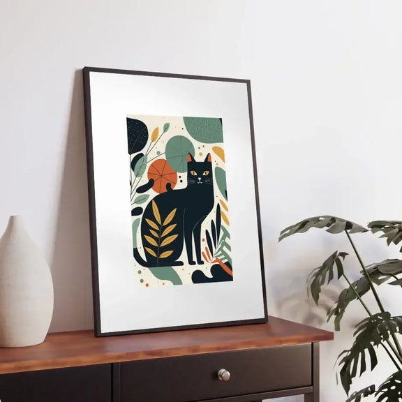 Garden Cat Matisse print in a frame on a table, showcasing vibrant colors and playful feline design inspired by classic art.