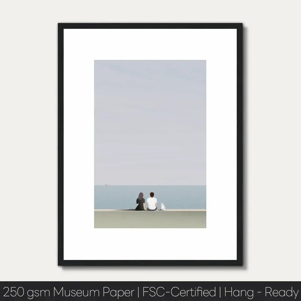 "Quiet Moments by the Sea art print featuring a couple sitting by the tranquil seaside, showcasing serene landscape on museum-grade paper"