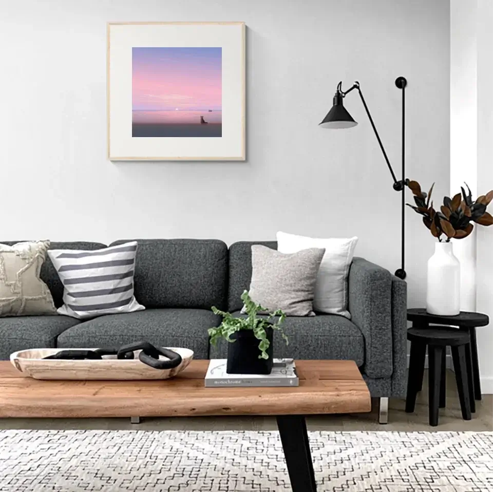 Elegant living room with "Silent Paws Before Sunset" art print on the wall, featuring a cat silhouette against a sunset backdrop.