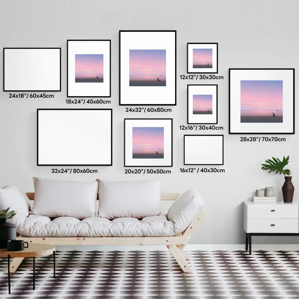 Gallery wall showcasing various sizes of Silent Paws Before Sunset art prints above a modern sofa in a stylish living room.