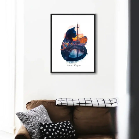 Watercolor painting of a cat with Las Vegas skyline, capturing city energy and nightlife in vibrant hues, framed on a living room wall.