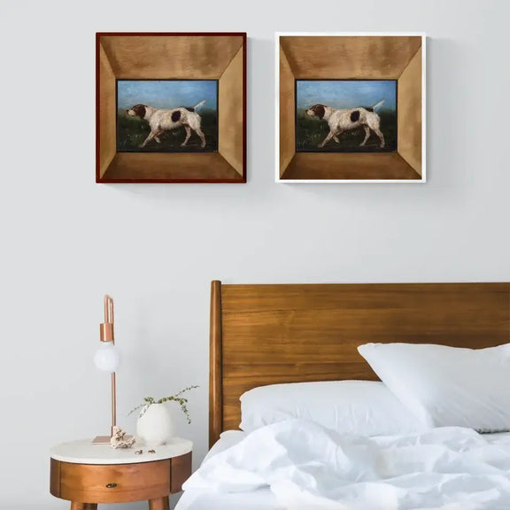 La Gousse 1880 vintage dog portrait wall art in frames displayed above a modern wooden bed and nightstand.