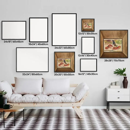 Gallery wall art display featuring framed prints of various sizes above a white sofa in a modern, geometrically patterned room.