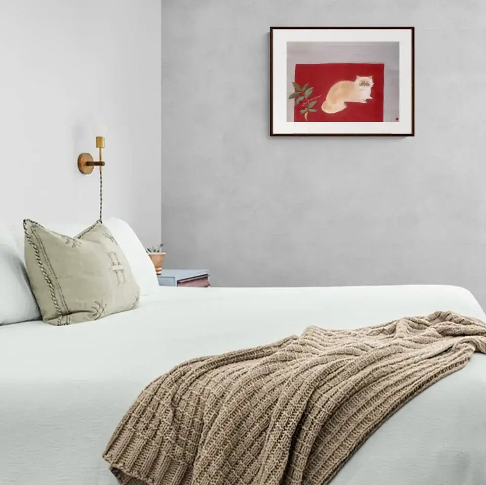 A serene bedroom with a Japanese cat painting by Togyu Okumura, featuring a ruffled cat lounging in repose on a vibrant red background.