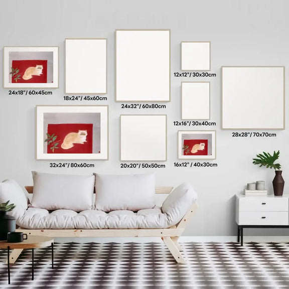 Gallery wall layout with various blank frames featuring a Japanese cat painting, displayed above a modern sofa.