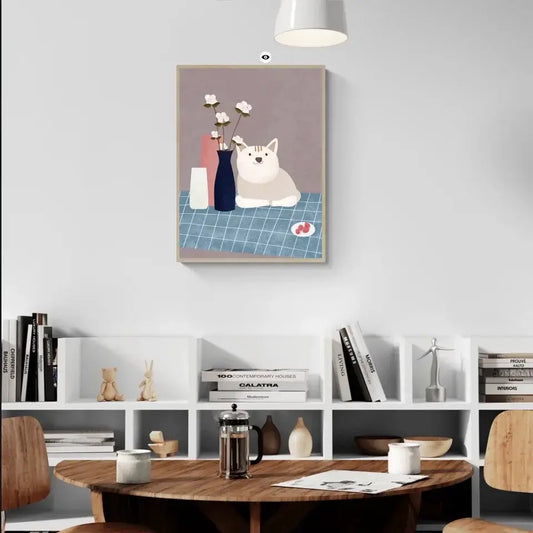 Art print of a cat in a still life setting on a tabletop, adding warmth and charm to a stylish, modern home interior.