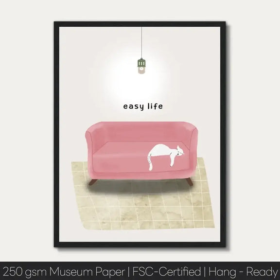 Art print of a cat napping on a pink sofa with the words "easy life" above, bringing a relaxed vibe to your decor.