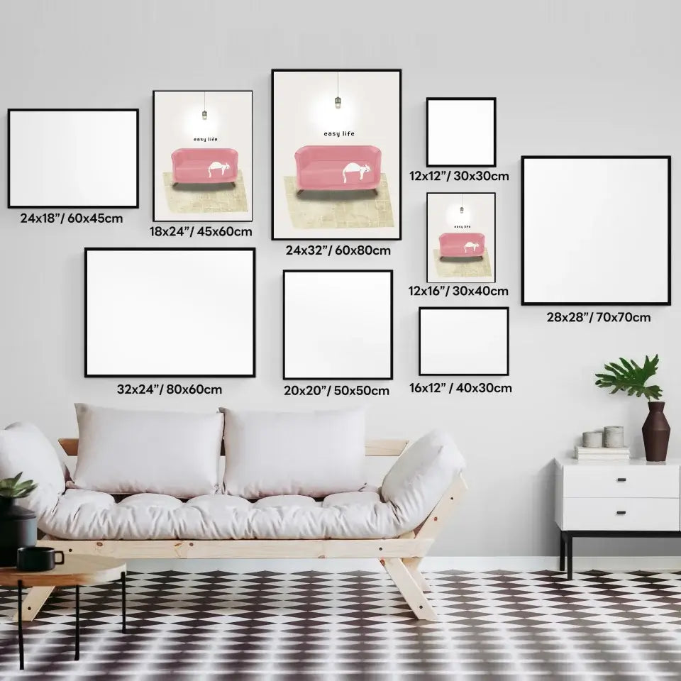 Various sizes of Cat Nap Art Print displayed on wall above sofa, illustrating home decor options.