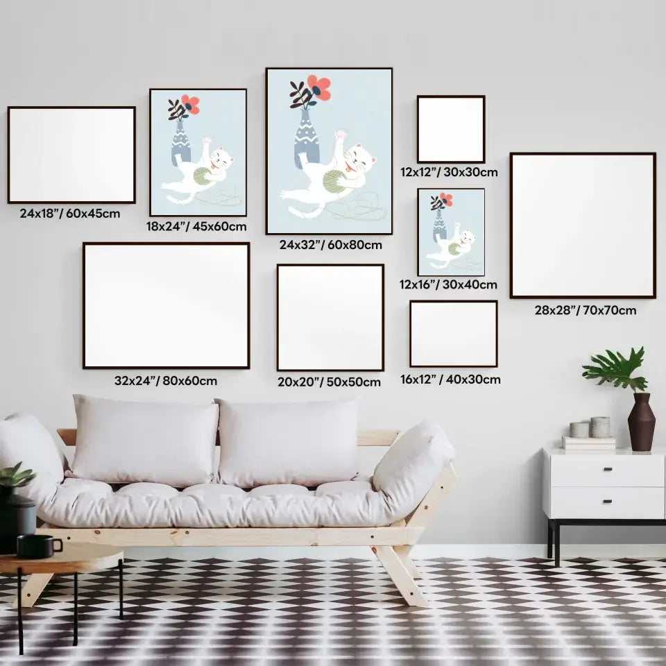 gallery wall with various frame sizes above a modern sofa, highlighting a cat with yarn ball art print among blank frames.